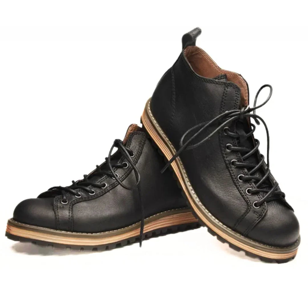 Three-quarter view of men's outdoor boots with mid-ankle support and classic design