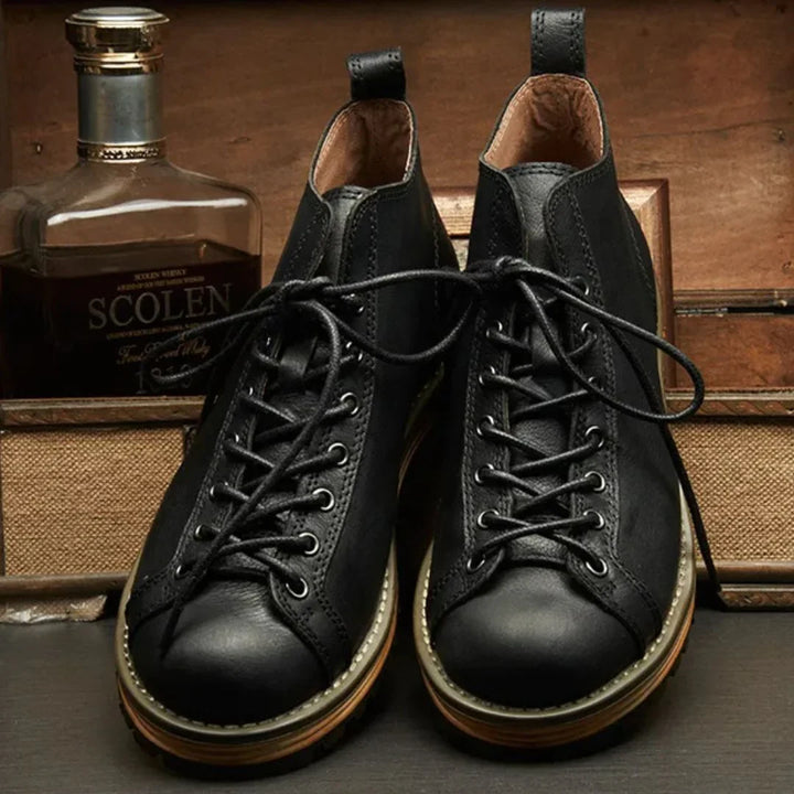 Men's hiking boots with traditional lace-up system and rugged sole for outdoor adventures