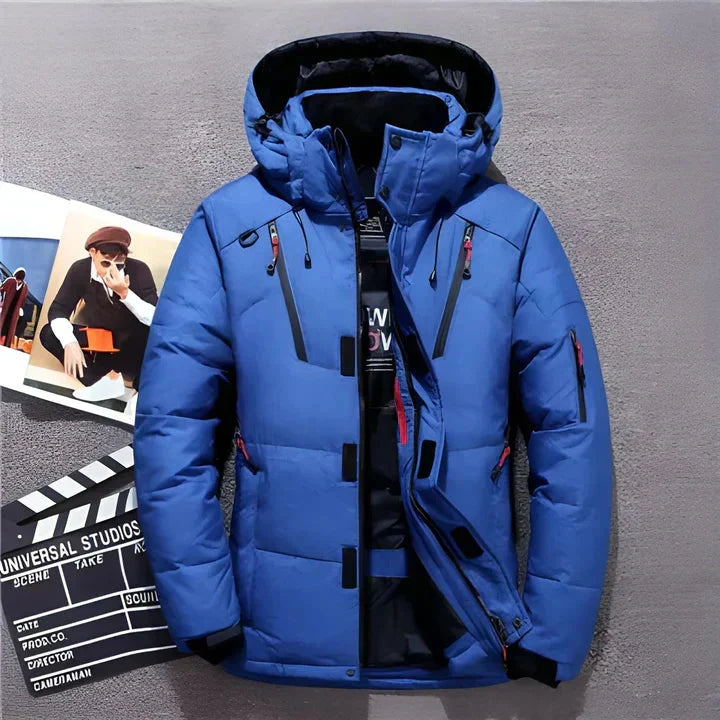 Detail of men's hooded winter jacket featuring snap-button placket and chest pocket