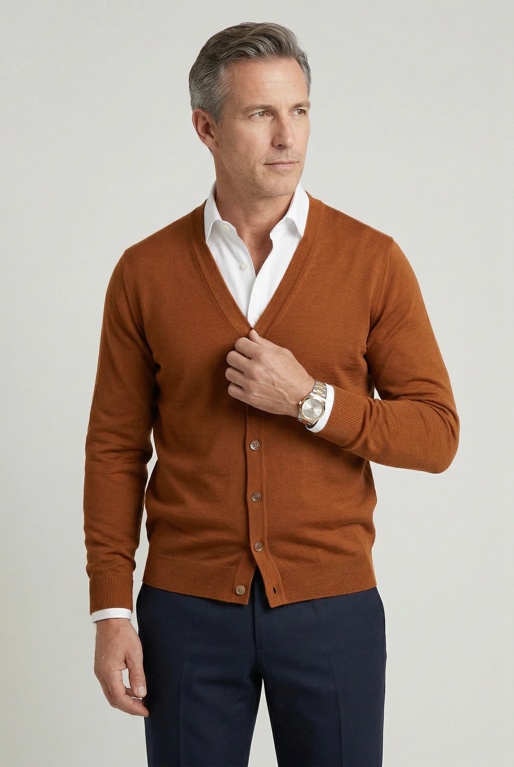 Detail shot of cardigan buttons and V-neck opening on men's knitwear