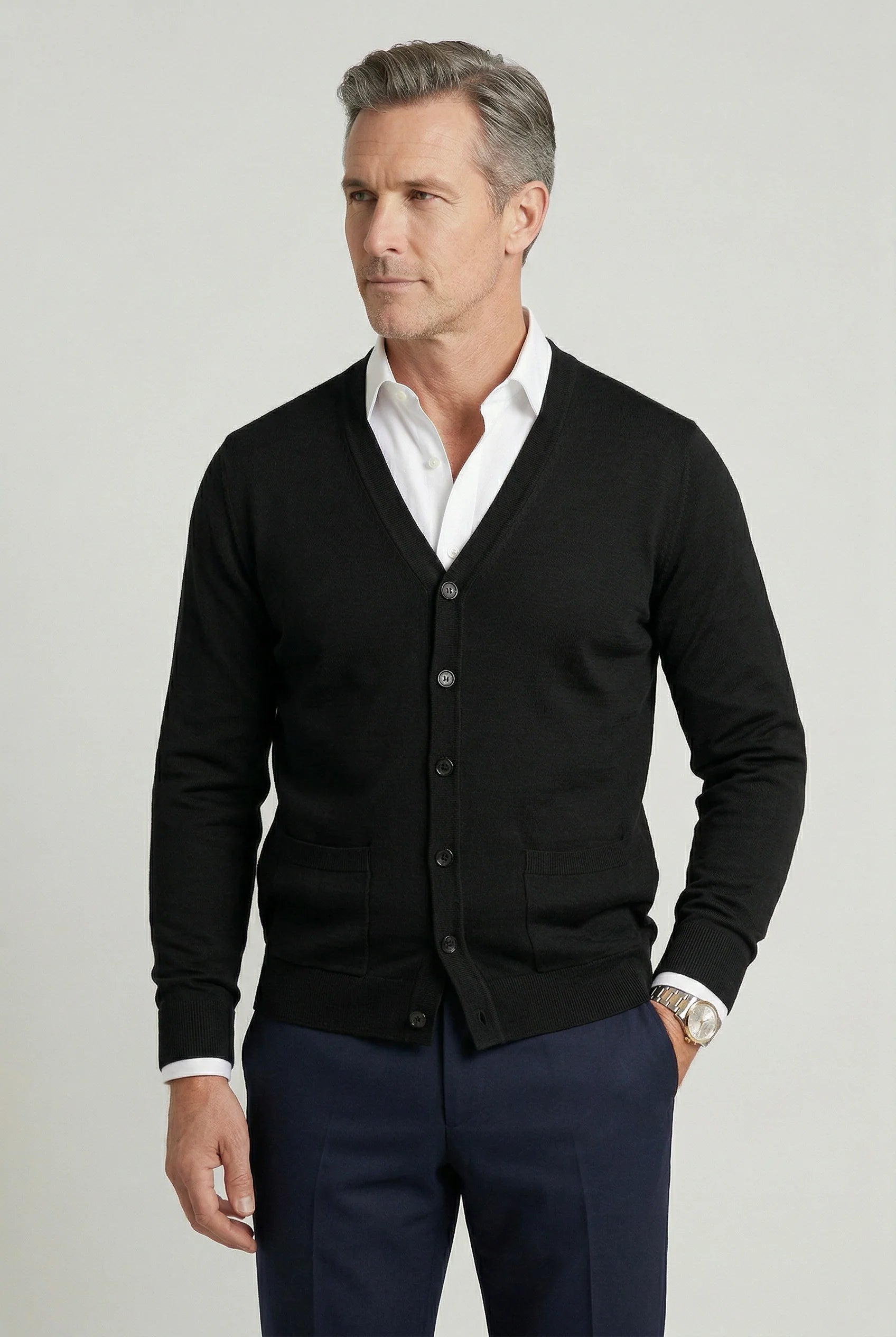 Men's cardigan styled for smart casual wear with shirt and navy trousers