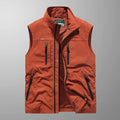 Men's multi-pocket gilet in burnt orange with stand collar and contrast zip pockets
