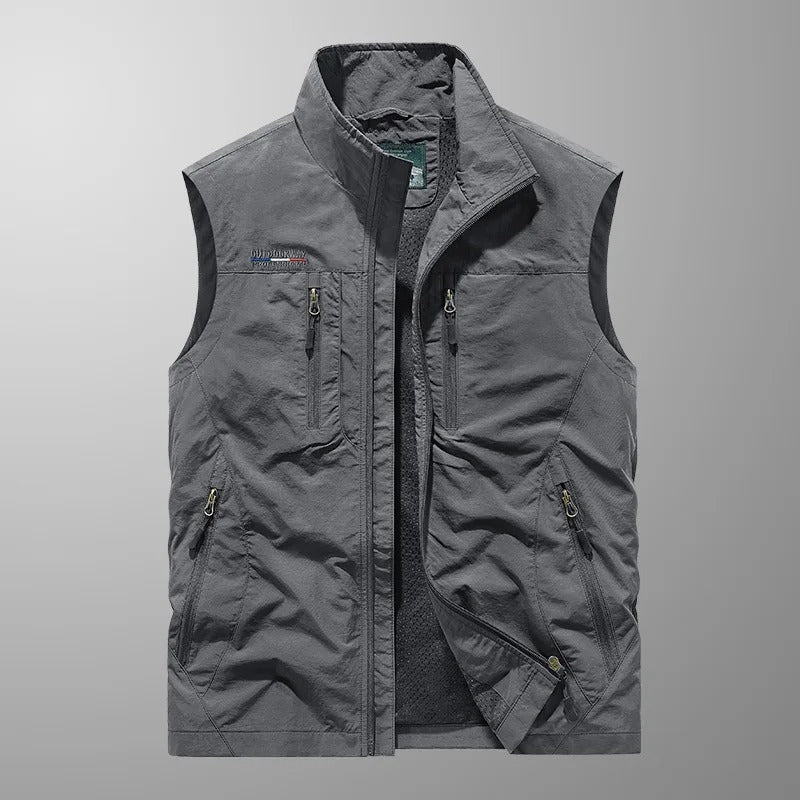 Close-up of multi-pocket gilet chest pockets with contrast zip detailing and embroidered logo