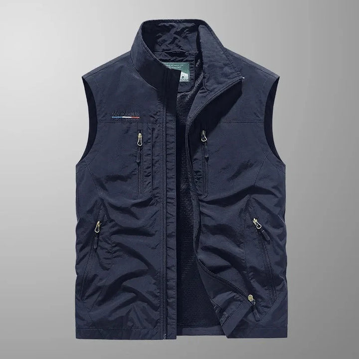 Detail shot of men's outdoor gilet zip closure and stand collar design