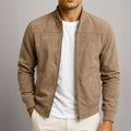 Close-up view of men's suede bomber jacket showing textured finish and stand collar