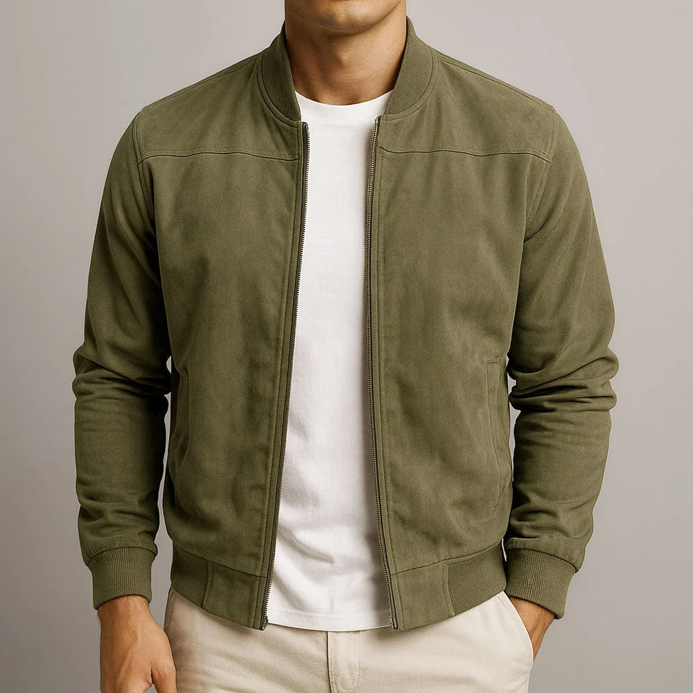 Men's suede bomber jacket styled with white tee and cream trousers for casual wear