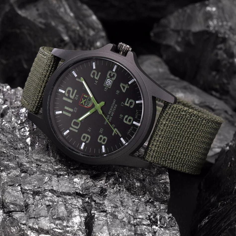 Side profile of black military watch with adjustable canvas strap and protective crown