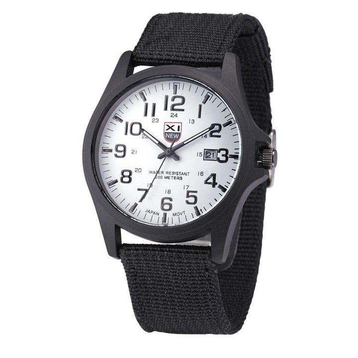 Black canvas strap detail on men's military-style watch with secure fastening system