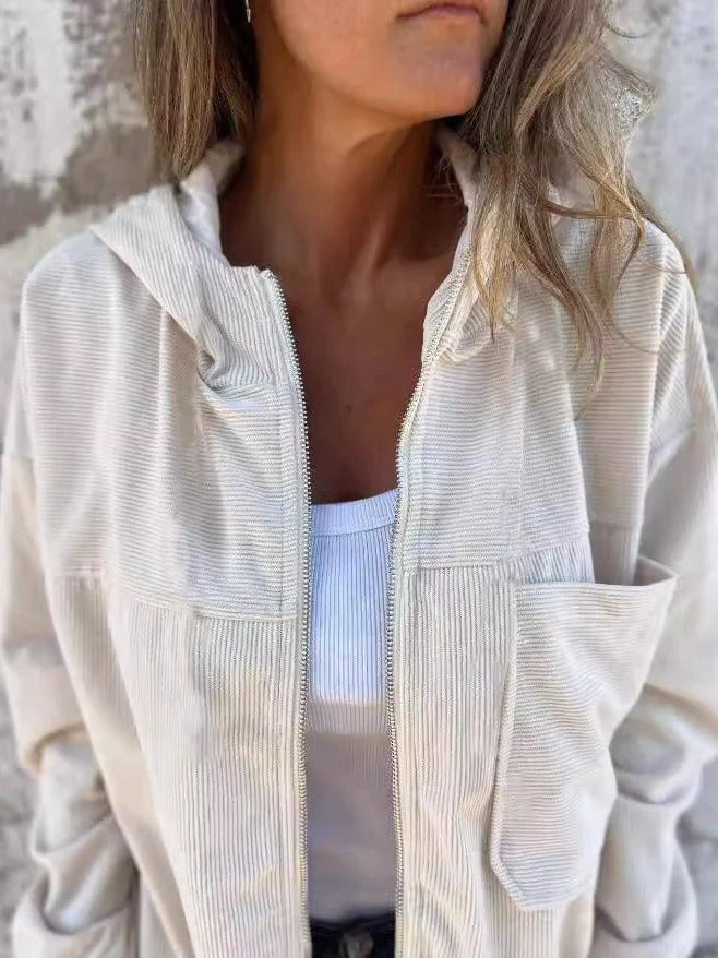 Women's corduroy hooded jacket in cream with relaxed fit and zip-up front worn over white top