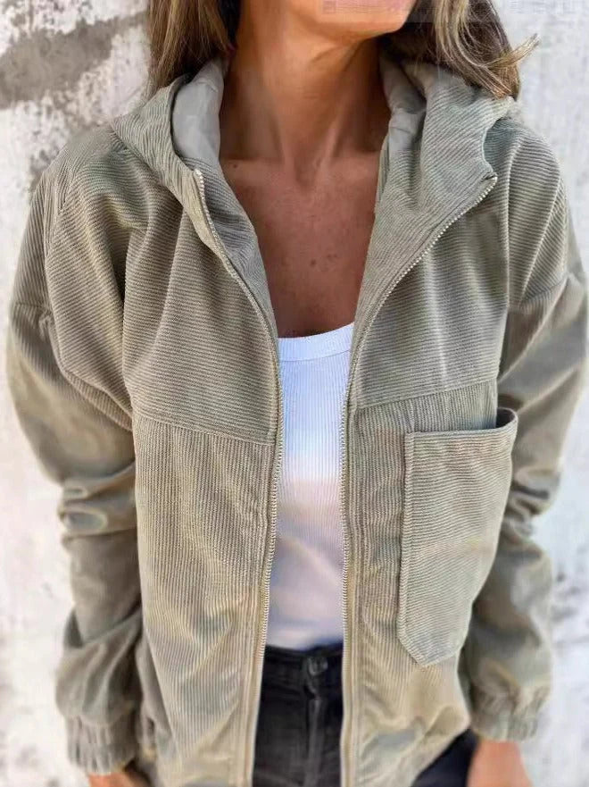 Side view of women's relaxed corduroy jacket with hood and ribbed cuffs in neutral tone