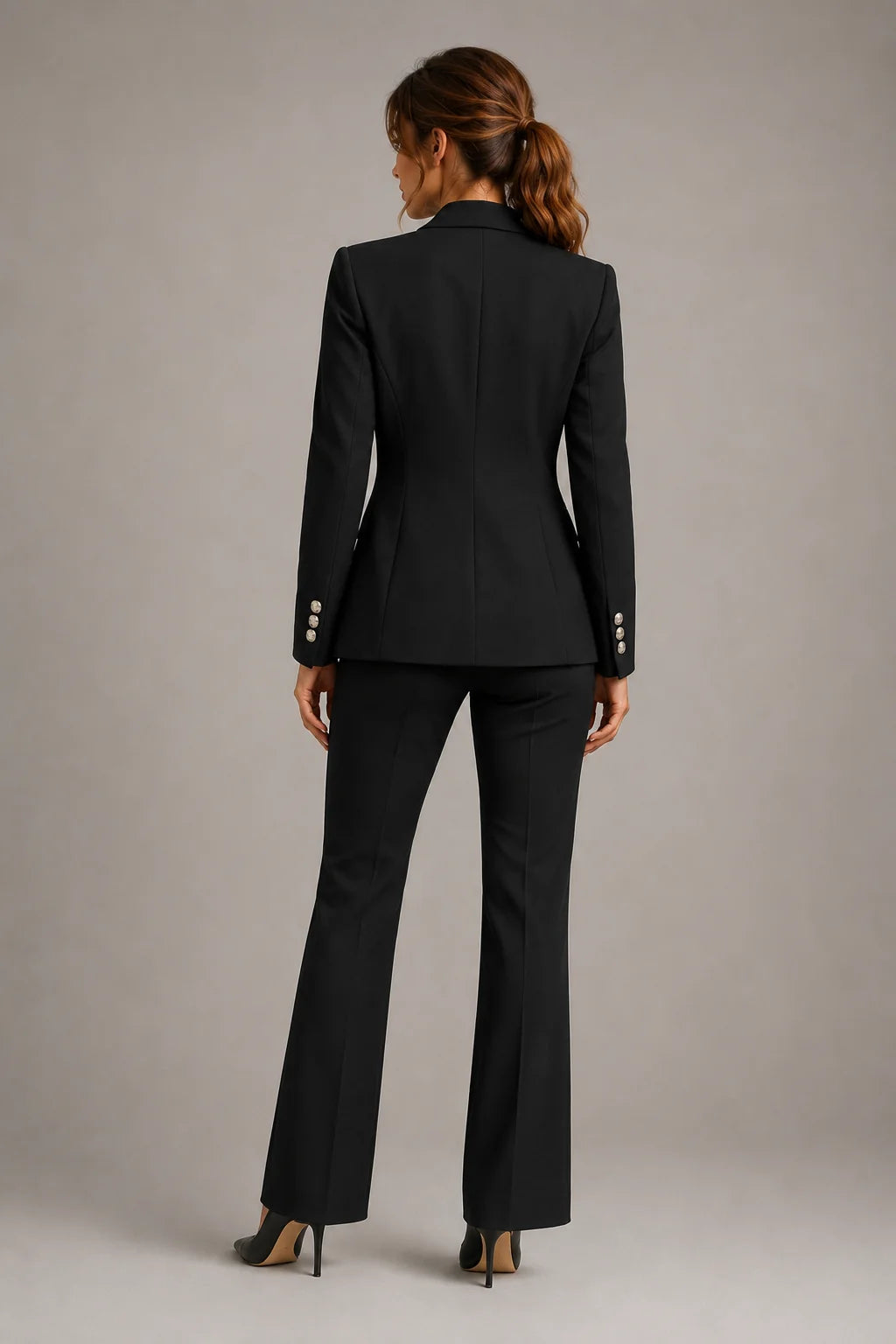 Full-length view of two-piece suit styled with heels for formal office wear