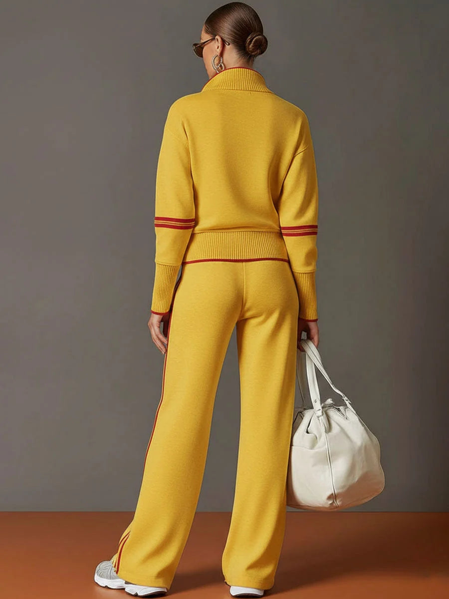 Woman wearing cream tracksuit set with hands in trouser pockets showing relaxed fit