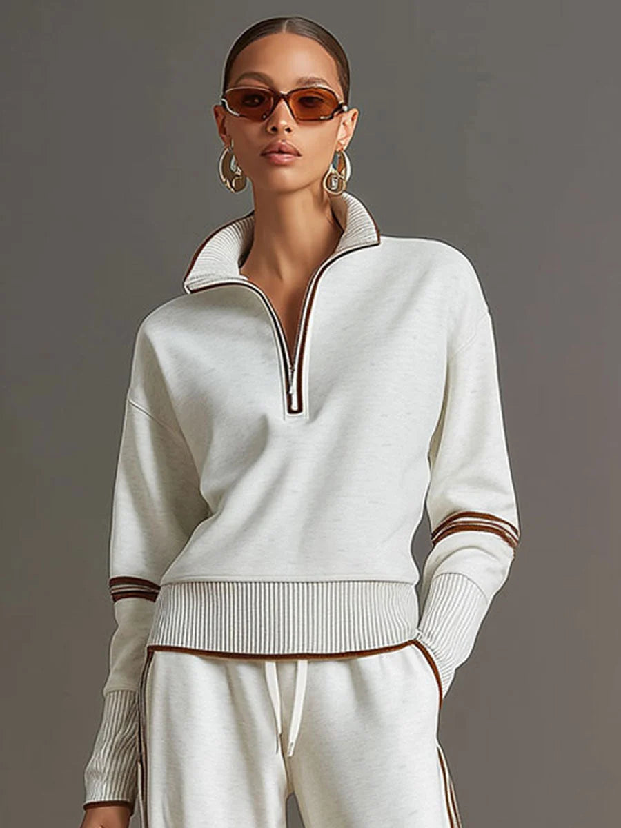 Detail of ribbed knit texture at cuffs and hem with contrasting sporty trim