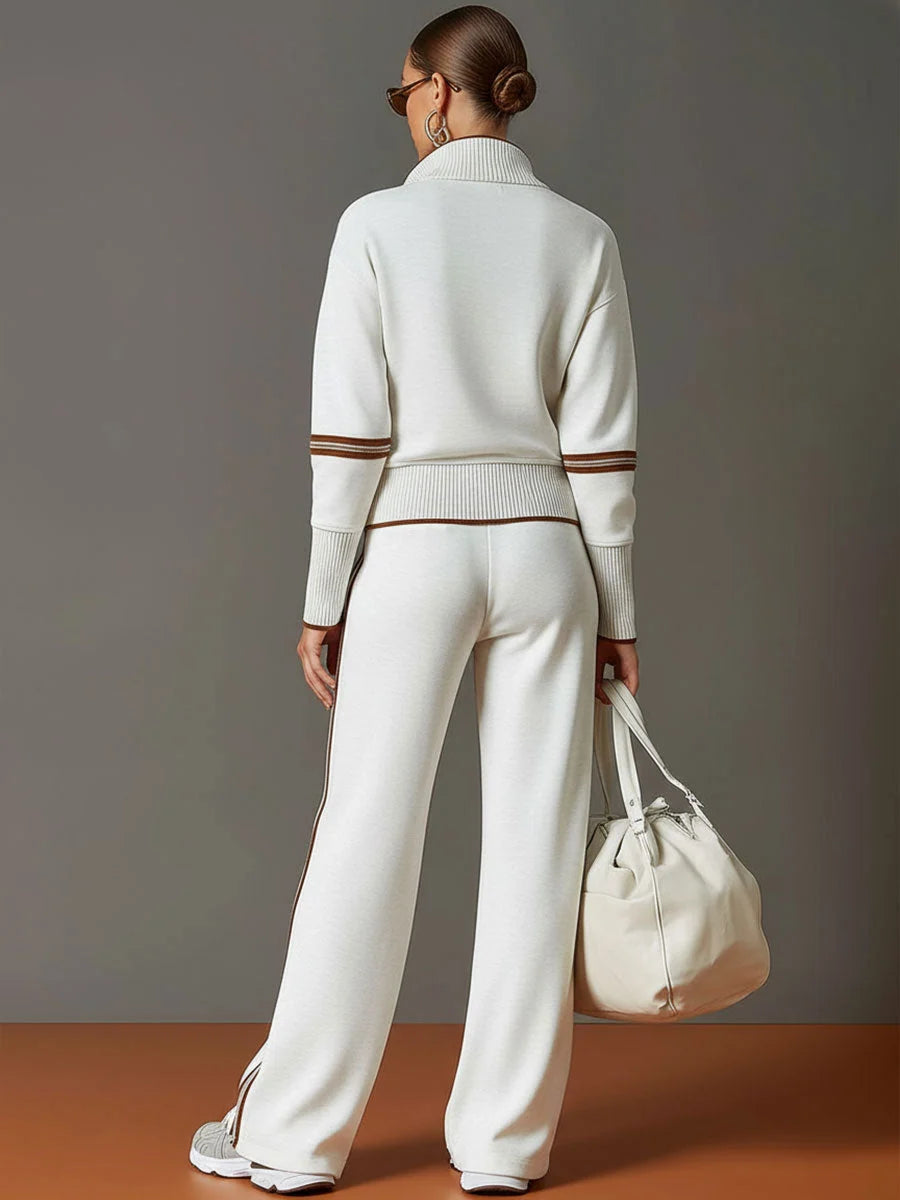 Detail of ribbed cuffs and hem with contrasting brown stripe trim on tracksuit jumper