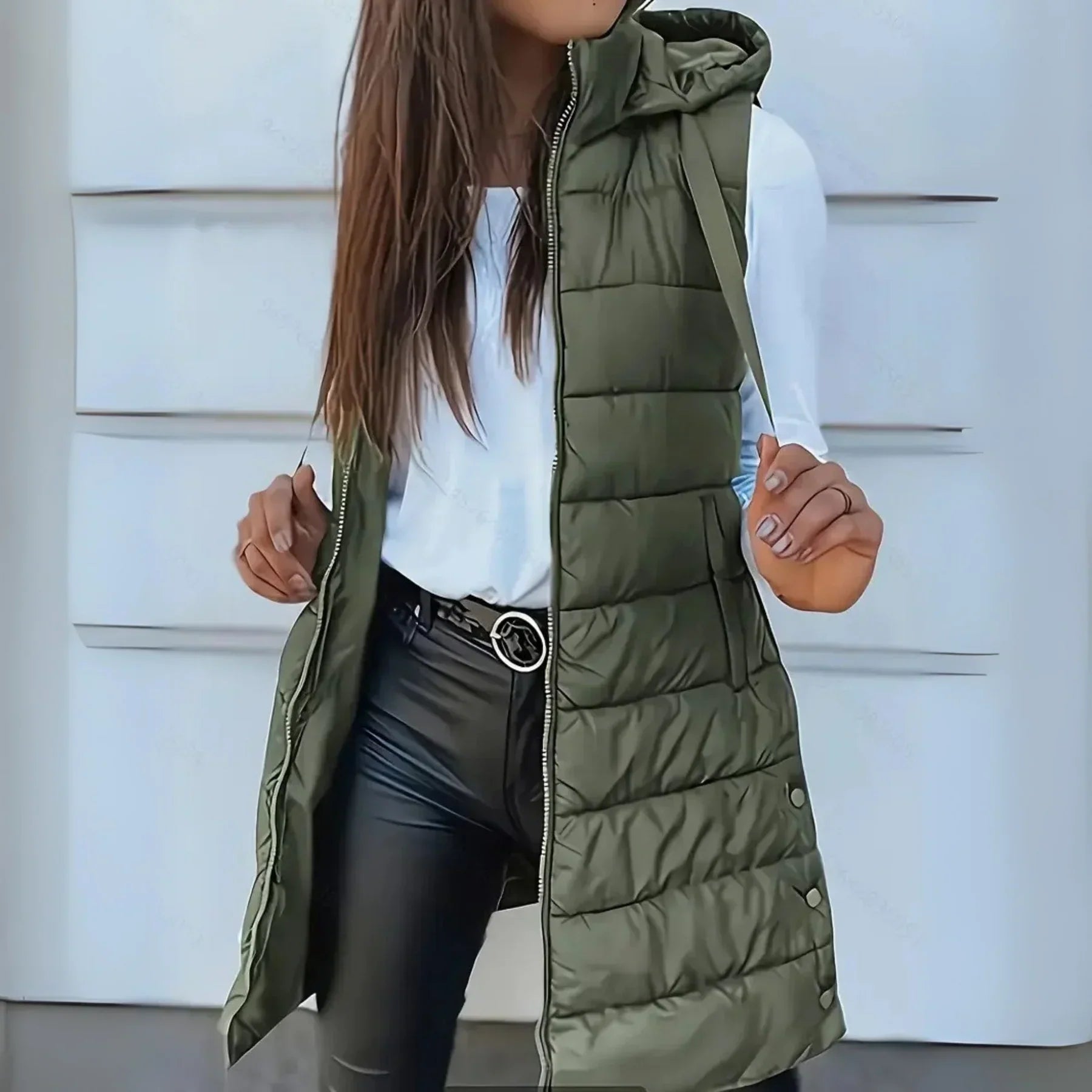 Detail shot of quilted puffer gilet featuring zip-front closure and structured hood design