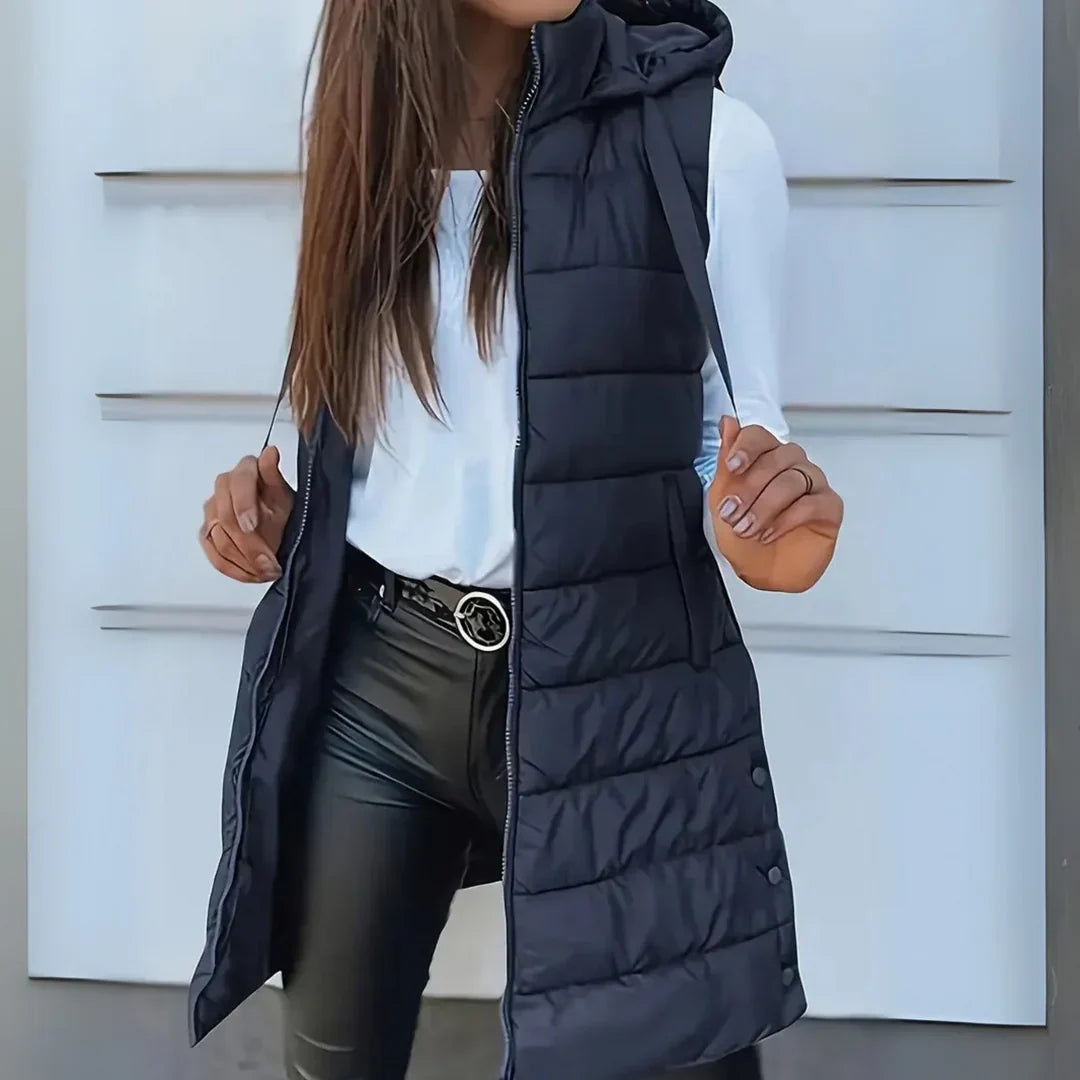 Women's sleeveless puffer gilet styled with leather-look trousers for casual layering outfit