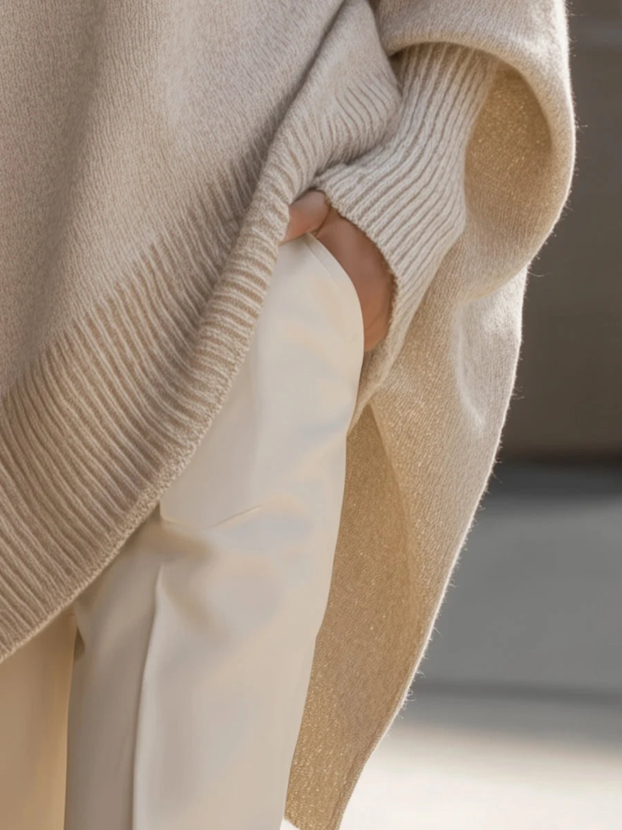 Detail shot of ribbed cuffs and hem on women's oversized knit jumper