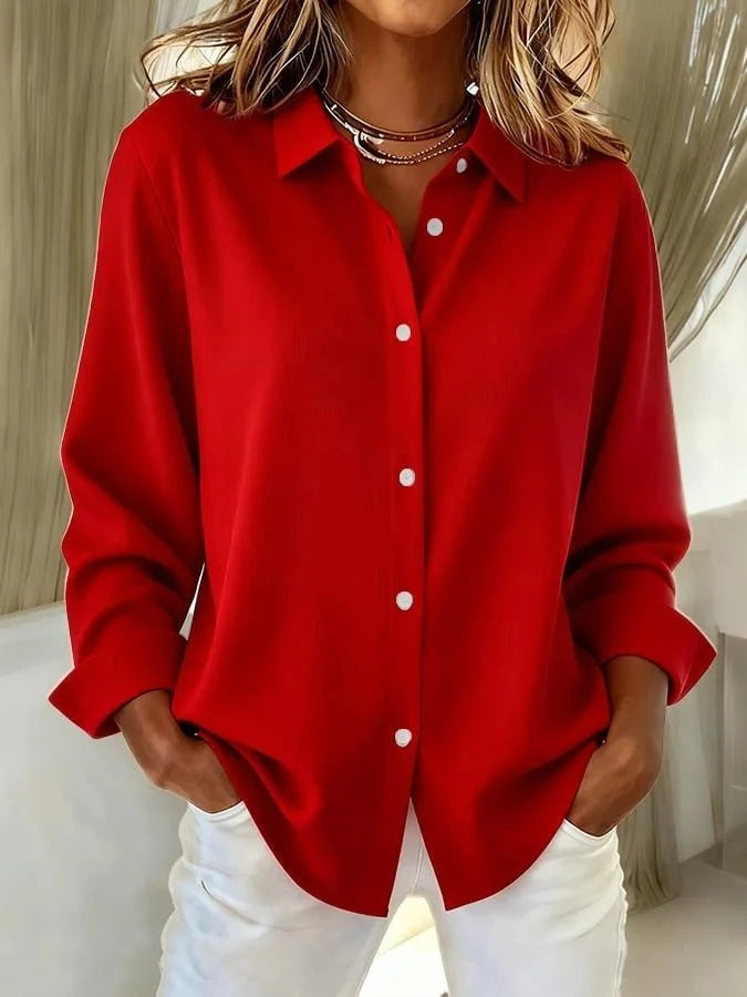 Side view of women's oversized pink shirt displaying longline length and roomy silhouette below the hip