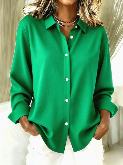 Women's oversized shirt styled casually with cuffed sleeves, demonstrating versatile workwear and weekend styling options