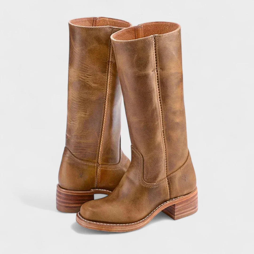 Side view of women's tall riding boots showing equestrian-inspired silhouette and contrast stitching