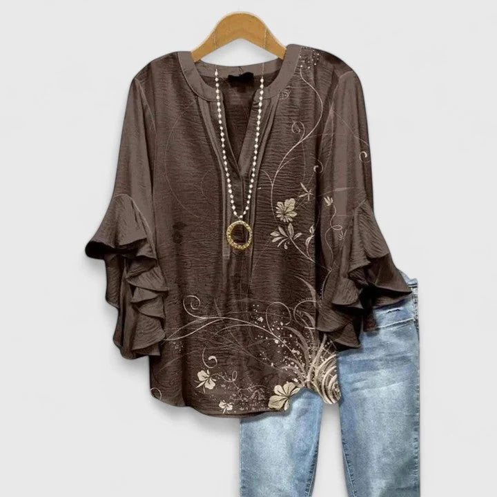 Back view of floral print blouse showing length and drape of lightweight fabric