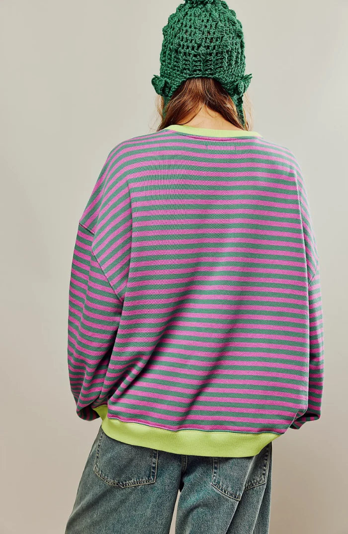 Close-up of oversized striped jumper showing bold horizontal stripes and relaxed boxy fit