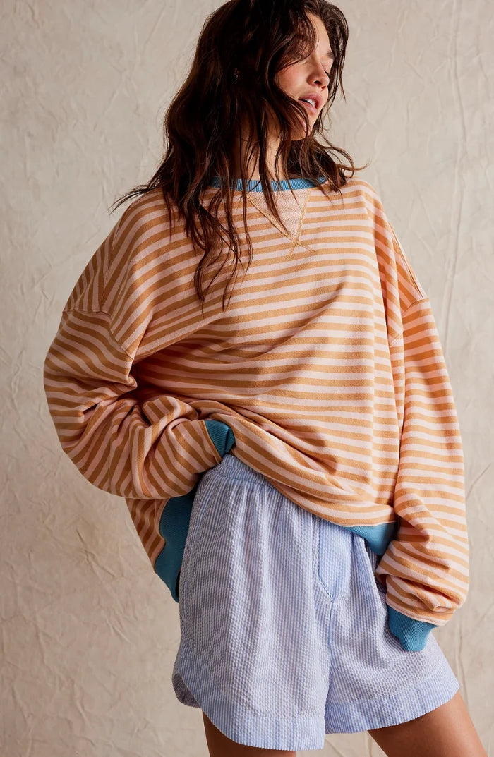 Women's oversized striped jumper in green and pink colourway with neon yellow trim