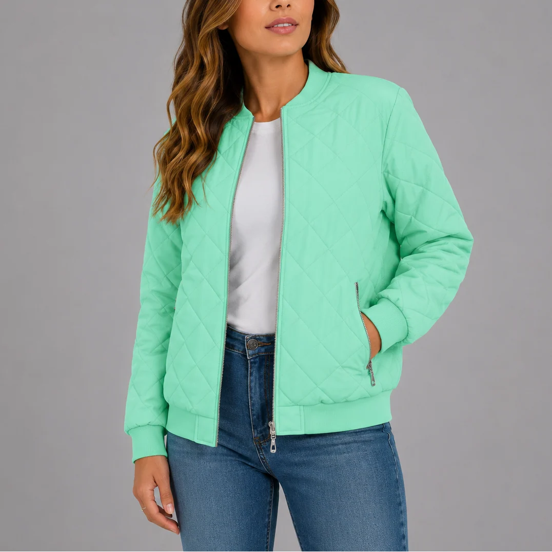 Woman styling the quilted bomber jacket over a white tee with denim for casual layering