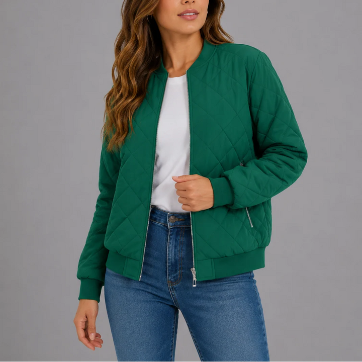Detail of the side slip pockets and structured quilted fabric on the bomber jacket
