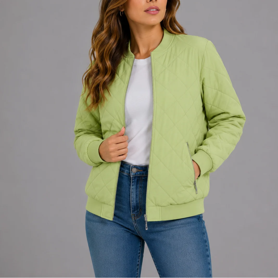 Woman in the quilted bomber jacket styled with jeans for everyday transitional weather wear