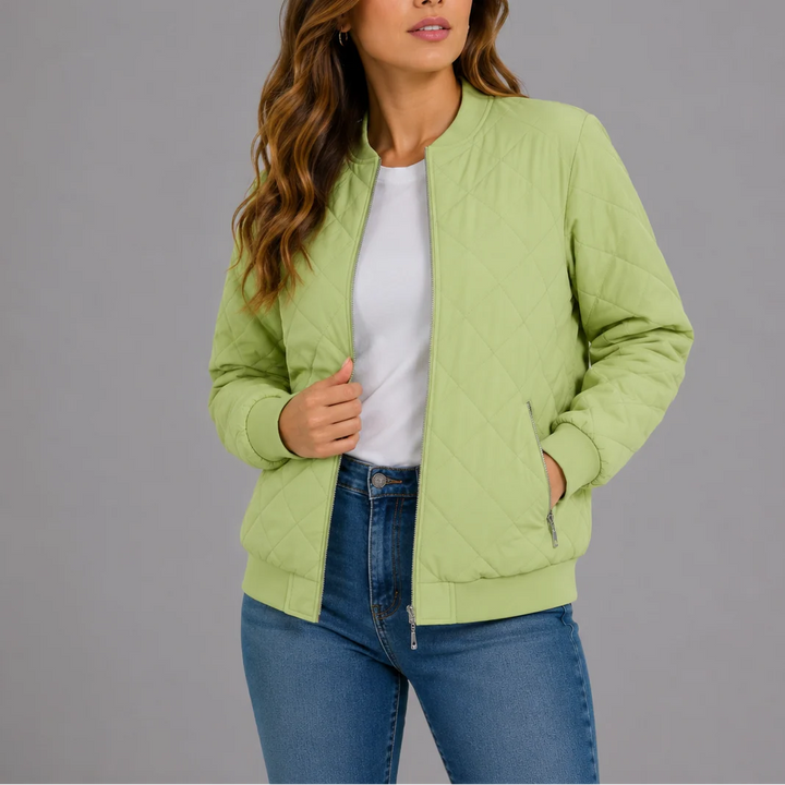 Woman in the quilted bomber jacket styled with jeans for everyday transitional weather wear