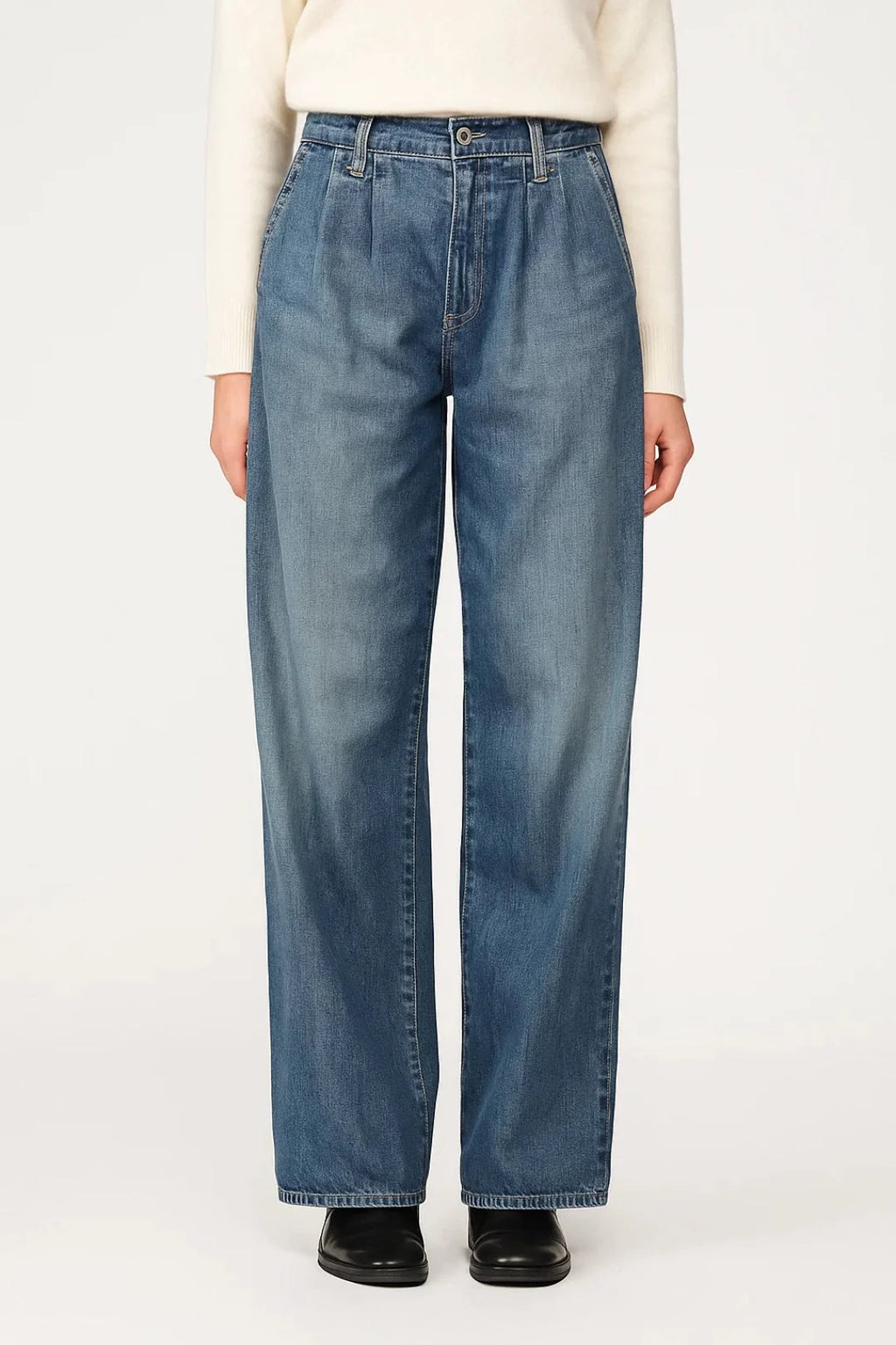 Women's wide leg jeans in light wash denim with high waist and relaxed fit worn with cream jumper