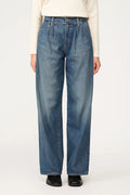 Women's wide leg jeans in light wash denim with high waist and relaxed fit worn with cream jumper