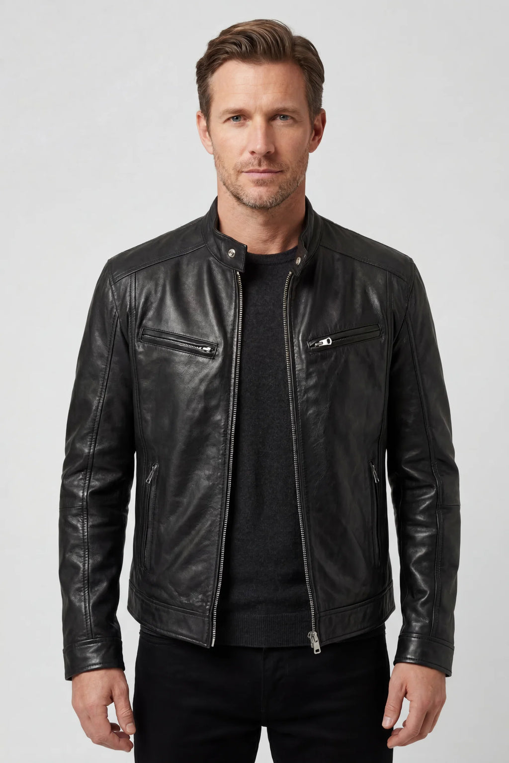 Men's biker jacket in black faux leather with multiple zip pockets and stand collar
