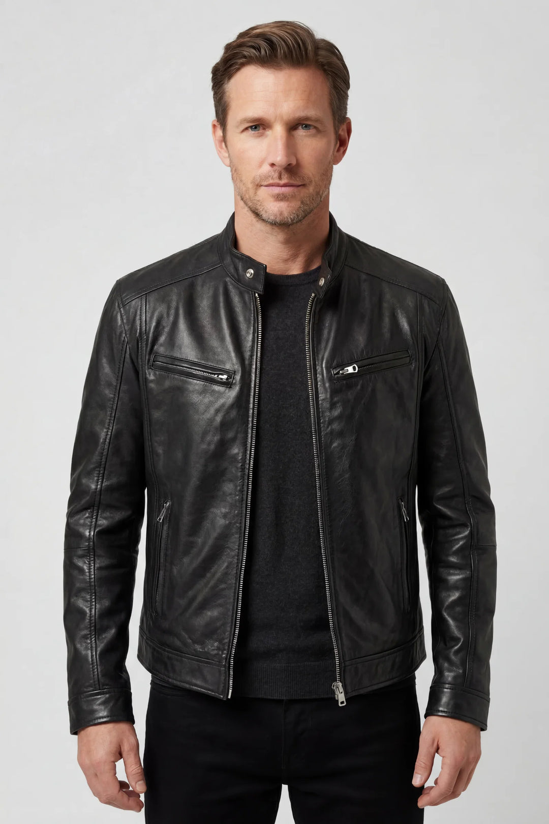 Men's biker jacket in black faux leather with multiple zip pockets and stand collar