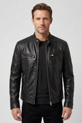 Men's biker jacket in black faux leather with multiple zip pockets and stand collar