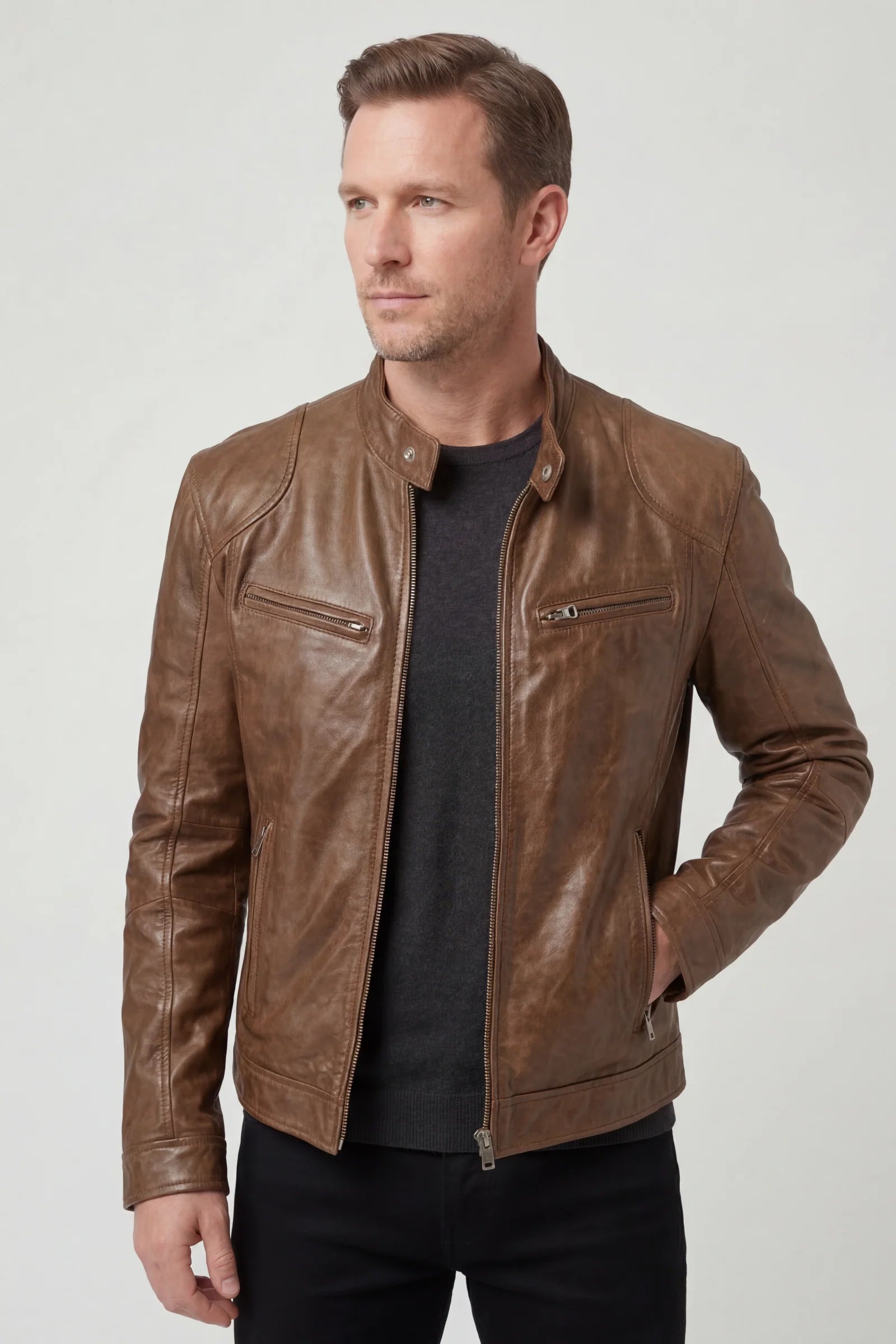 Men's biker jacket worn casually with dark jeans showing versatile styling