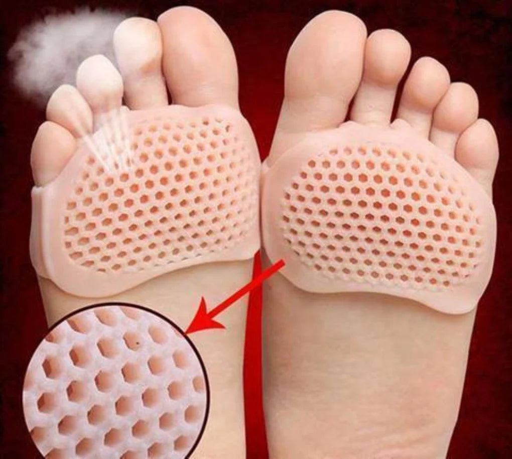 Gel metatarsal foot pads with honeycomb ventilation holes positioned on the soles of feet for cushioned forefoot support
