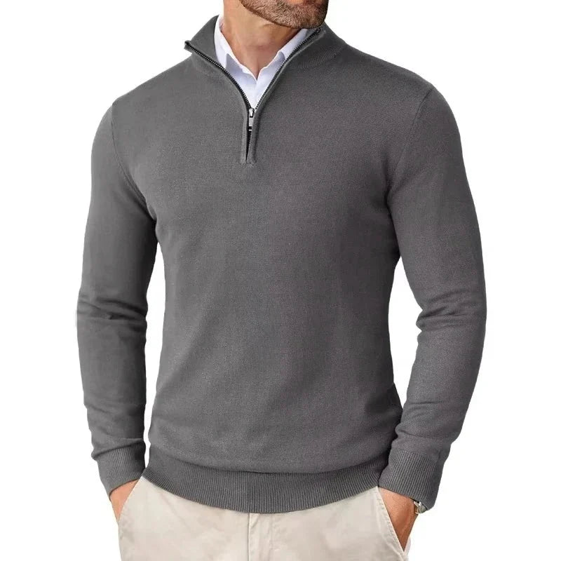 Close-up of quarter-zip collar detail on men's knit jumper showing ribbed trim and metal zip