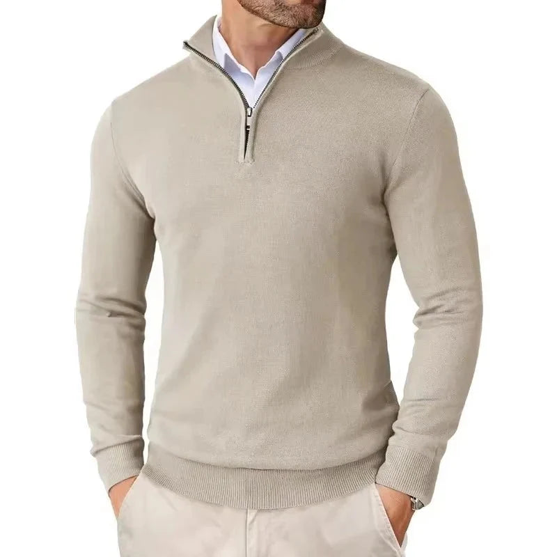 Side view of slim-fit quarter-zip jumper on male model paired with beige chinos