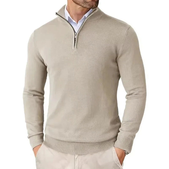 Side view of slim-fit quarter-zip jumper on male model paired with beige chinos