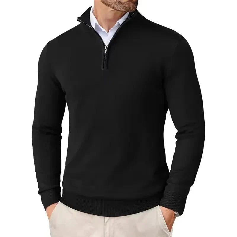 Detail shot of ribbed cuffs and sleeve construction on men's quarter-zip knit jumper
