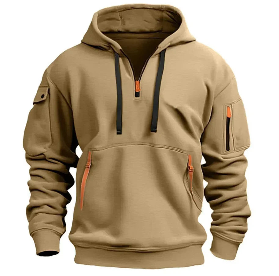Close-up of hoodie half-zip closure with orange zipper pull and contrast drawstring