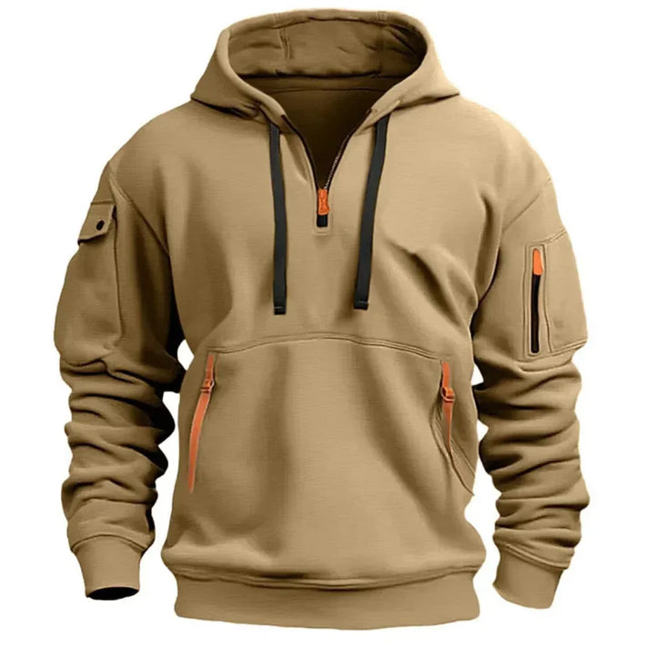 Close-up of hoodie half-zip closure with orange zipper pull and contrast drawstring