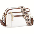 White crossbody bag with embroidered floral strap and gold hardware featuring three zip compartments