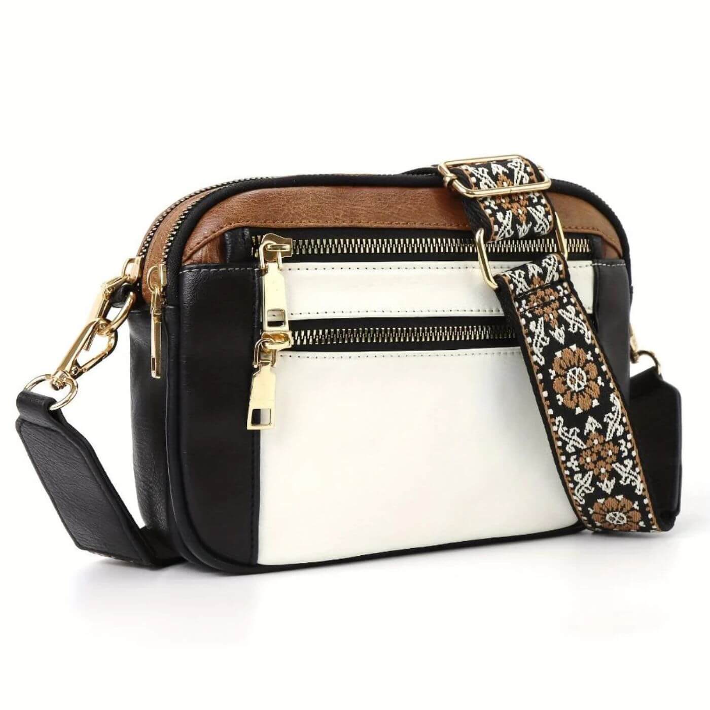 Front view of crossbody bag showing multiple zip compartments and smooth finish construction