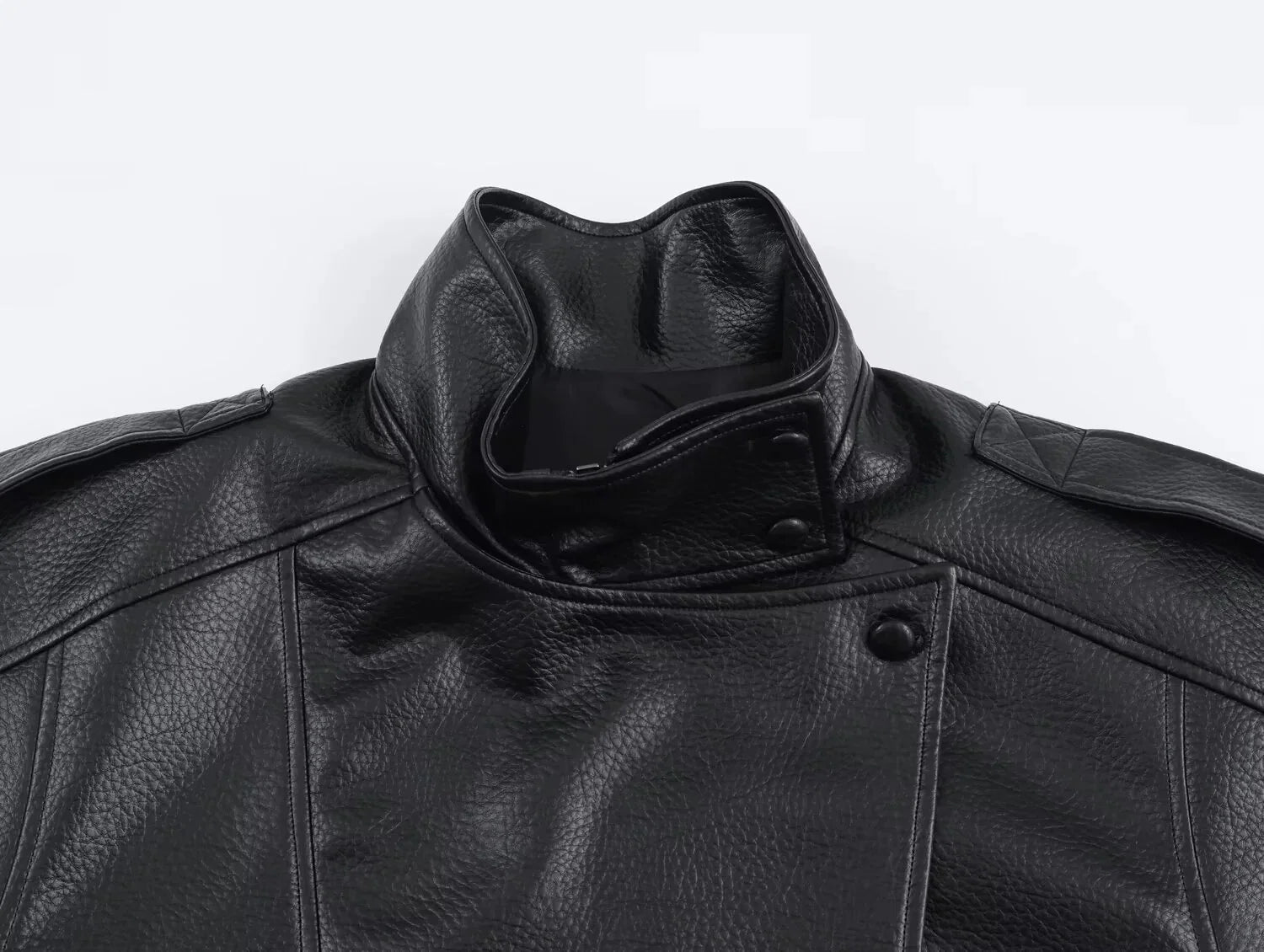 Full view of women's black bomber jacket with structured silhouette and smooth finish