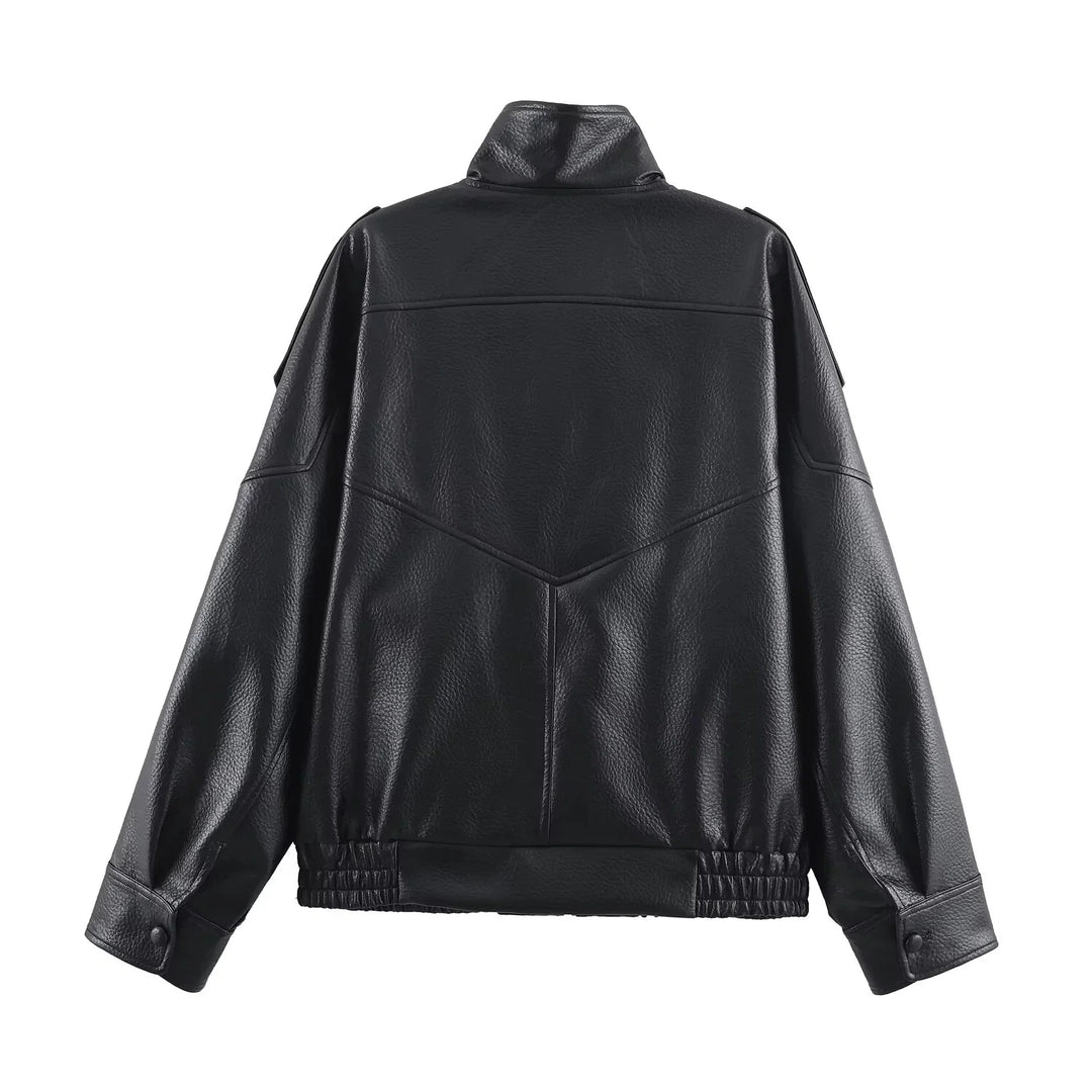 Close-up of women's bomber jacket showing structured faux leather finish and zip fastening