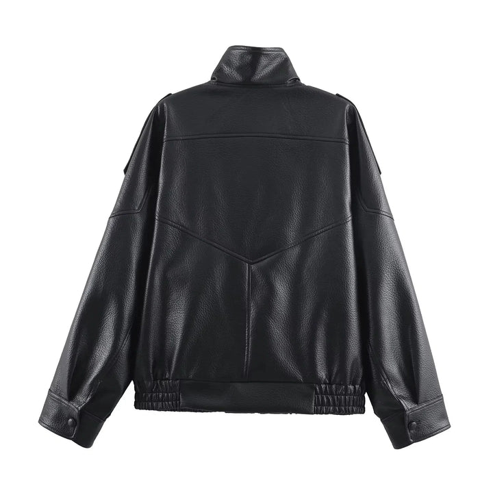 Close-up of women's bomber jacket showing structured faux leather finish and zip fastening