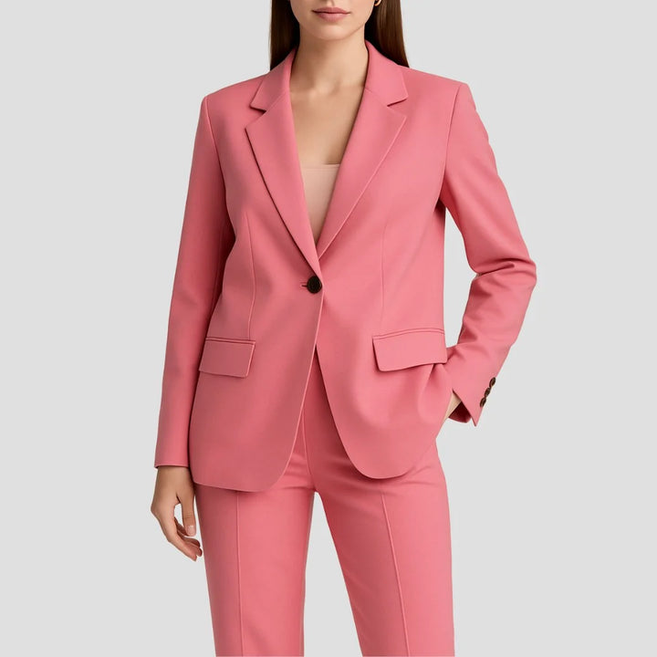 Beige two-piece suit set with fitted blazer and high-waist wide-leg trousers styled for formal occasions